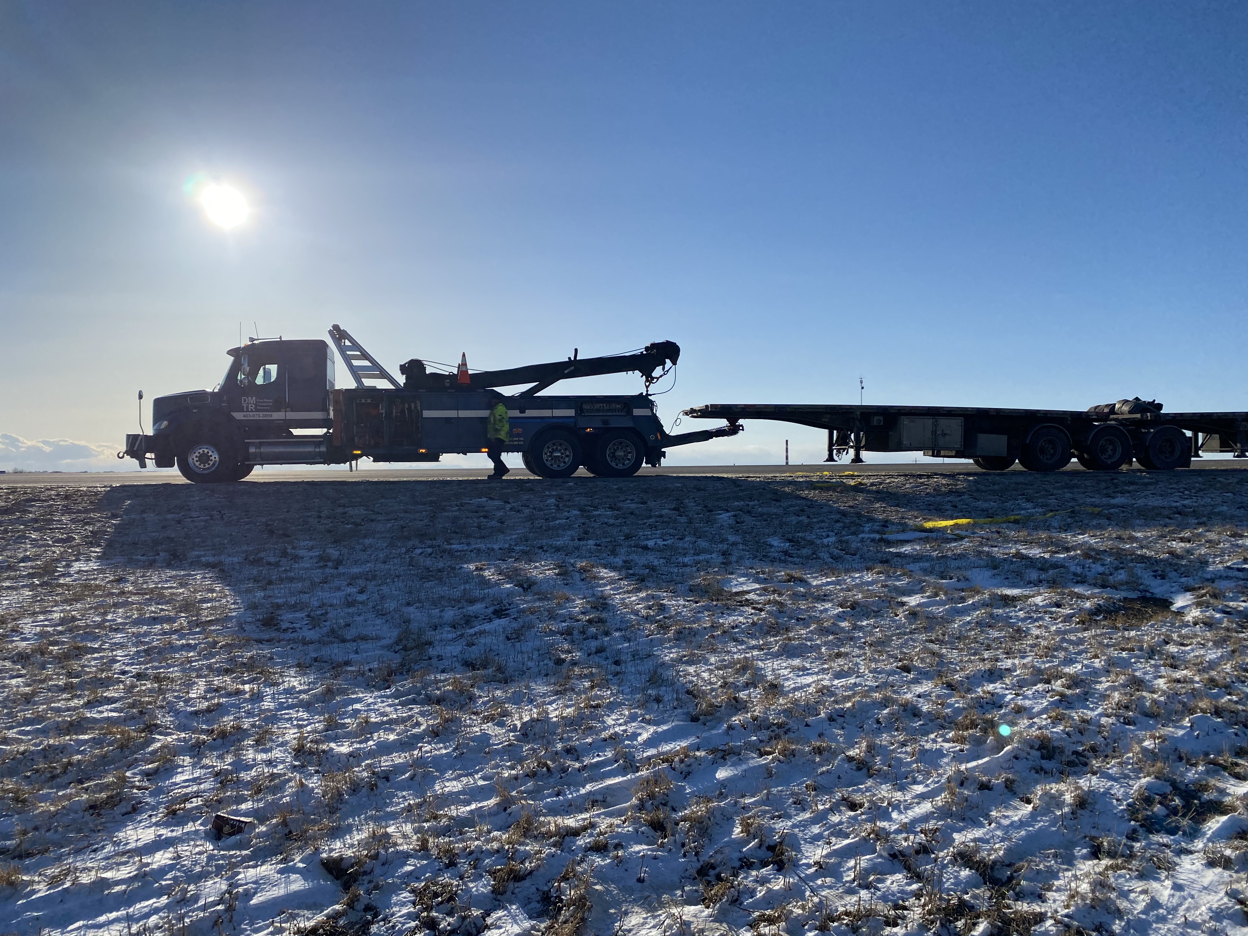 oversizes truck towing a flatbed